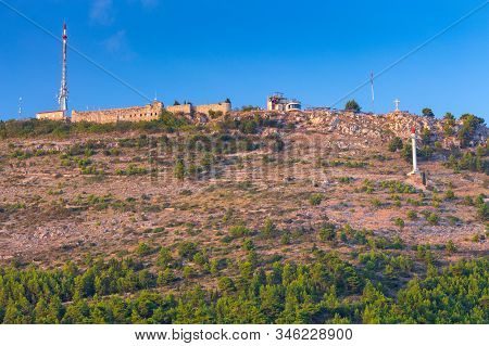 Stone Cross Monument On Mount Srd. Dubrovnik. Croatia.