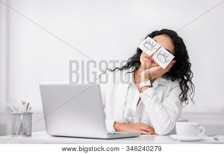 Insomnia. Lazy Unproductive Office Worker Girl Wearing Funny Sticky Notes On Her Eyes Sleeping At Wo
