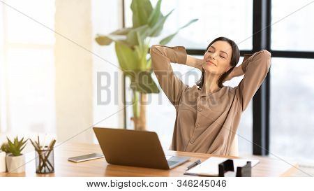 Relax At Office. Calm Girl Manager Leaning Back In Chair At Work, Panorama, Copyspace