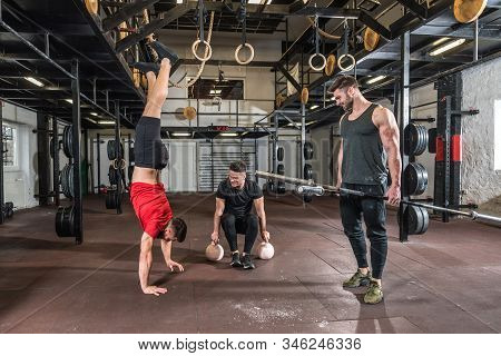 Gym Fun, Group Of Three Young Friends Fit Muscular Fitness Guys Having Fun Preparing For Hard Core C
