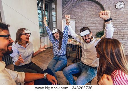 Happy Friendly Business Team Having Fun At Corporate Training, Funny Teambuilding Activity,  Playing