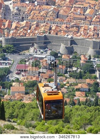 Dubrovnik, Croatia - August 4 2018: Cable Car Reaching Top Of Mountain Above Dubrovnik