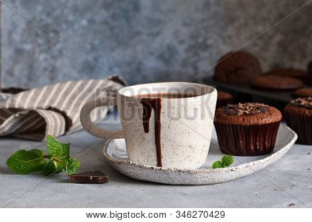 Christmas Drink - Hot Chocolate With Marshmallows And A Cupcake On A Concrete Background.
