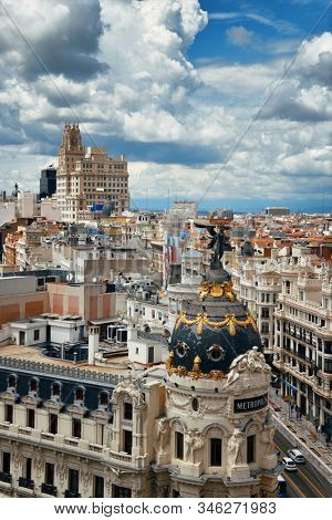 MADRID, SPAIN â MAY 13, 2019: Telefonica Building and historical buildings in business district rooftop view.