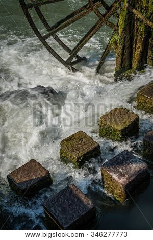 Detail Close Up Of The Old Historic Wooden Mill On The Riverbank Of Tuo River, Flowing Through The C
