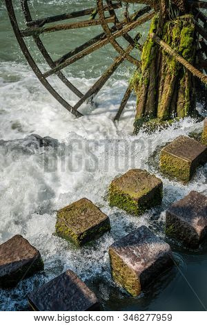 Detail Close Up Of The Old Historic Wooden Mill On The Riverbank Of Tuo River, Flowing Through The C
