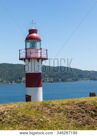Lighthouse In Niebla, Valdivia, Chile. Lighthouse In The Spanish Fortress In Niebla, Valdivia, Patag