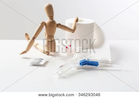 Composition With Anoscope On White Background. Hemorrhoid Treatment