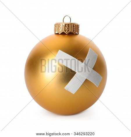 Shiny Gold Ball With Sticking Plasters Isolated On White