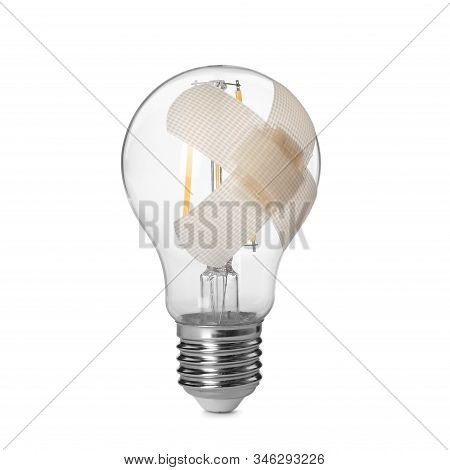 Light Bulb With Sticking Plasters Isolated On White