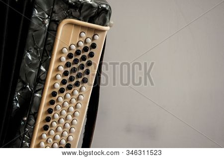 Fragment of classical retro bayan (accordion), musical instrument 