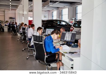 Petrozavodsk, Russia - June 18, 2019: Managers In Showroom With Cars Of Dealership Nissan In Petroza