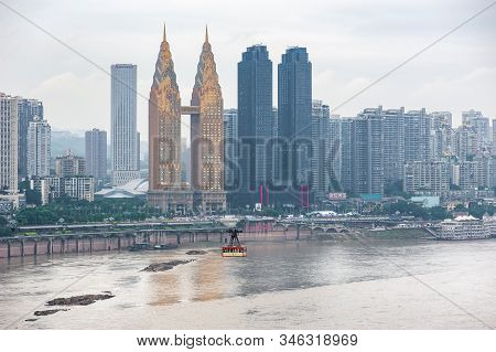 Chongqing, China - June 12, 2018 : Urban Cable Car Transporting Tourists Abobe The Yangze River With