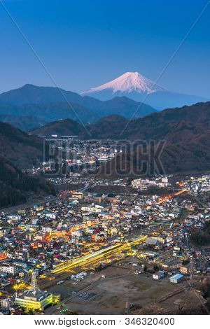 Otsuki, Japan skyline with Mt. Fuji at twilight.