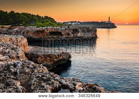 Sunrise With Rocks And Porto Colom Lighthouse, Mallorca