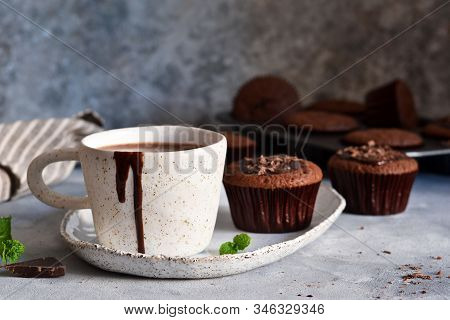 Christmas Drink - Hot Chocolate With Marshmallows And A Cupcake On A Concrete Background.