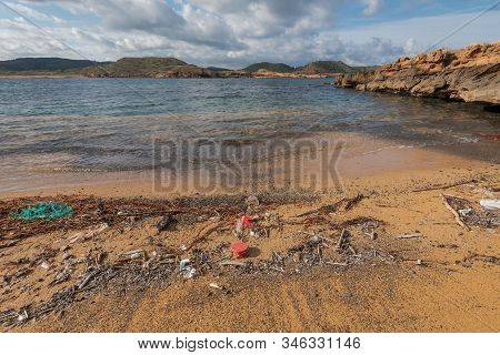 Plastic Pollution Mixed With Dried Seaweed On Paradisaical Beaches In Spain
