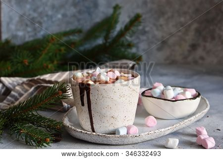 Hot Chocolate With Marshmallows And Muffin On A Concrete Background.