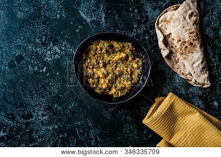 Indian Dish Spinach Lamb Palak With Chappati Flat Bread.