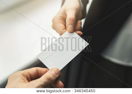 Close Up Of People Swapping Blank Business Card. Mockup