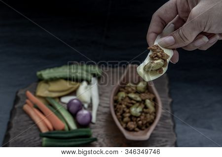 Thai Food, The Hand Is Using Ginger To Scoop Southern Thai Dry Curry With Ground Pork Khua Kling, Th