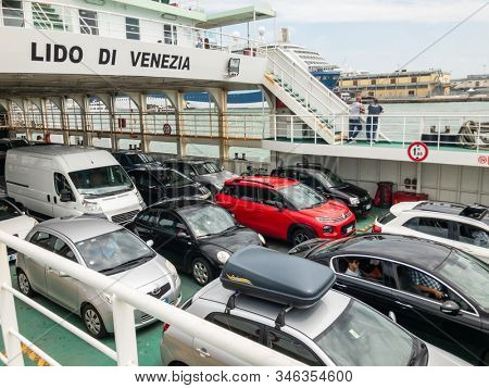 Lido, Italy - August 12, 2019: Ferry between Lido and Venice carries cars and passengers