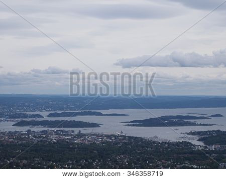 Cloudy Landscapes Of Fjord Near European Town Of Oslo In Holmenkollen District In Norway With Overca