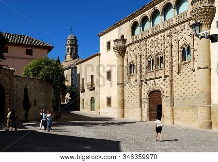 Baeza, Spain - July 28, 2008 - View Of Jabalquinto Palace With The Cathedral Bell Tower To The Rear,
