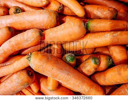 Orange Organic Carrots Stacked On Each Other In The Market Grocery Store Ready For Sale As A Part Of