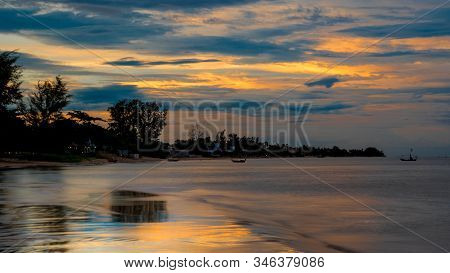Reflection Of Coastline Of Pak Nam Pran At Dusk In Thailand Just After Sunset