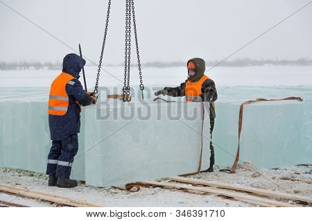 Slingers In Special Winter Overalls For Shipment Of Ice Blocks