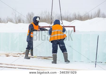Slingers In Special Winter Overalls For Shipment Of Ice Blocks