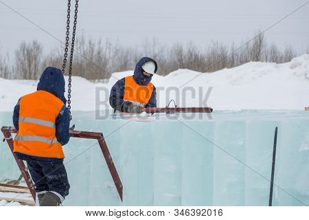 Slingers In Special Winter Overalls For Shipment Of Ice Blocks