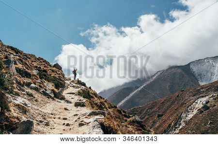 Young Hiker Backpacker Female Taking Brake In Hike Walking During High Altitude Everest Base Camp (e