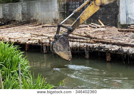 Excavator Or Digging Machine Working Bucket Digging Ground In Canal The Process Of Construction Site