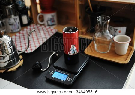 Home Manual Coffee Brewing Still Life. Red Grinder On Electronic Scale. Third Wave Speialty Coffee A