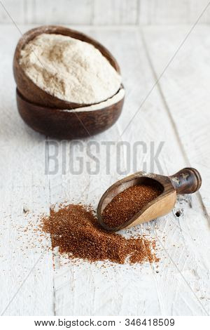 Teff Flour In A Bowl And Teff Grain With A Spoon Close Up