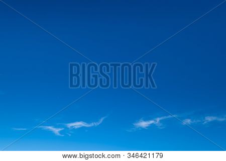 White Fluffy Cirrus And Cirrocumulus Clouds In Deep Blue Azure Sky. Summer Good Weather Concept Back