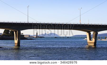 Bouzas Bridge With Sea Museum And Cies Islands On Background In Vigo City, Pontevedra, Spain.
