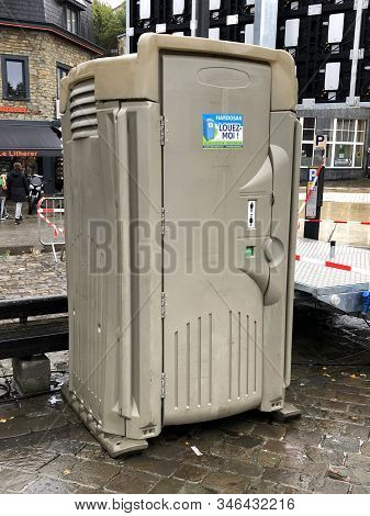 La Roche, Belgium - October 20, 2019: Hardosan Louez-moi Rental Bio-toilet On A Public Road In The B