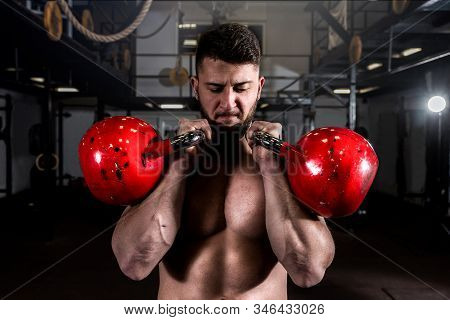 Kettlebell Workout, Young Fit Sweaty Muscular Man With Big Muscles Holding Two Big Old Kettlebells W