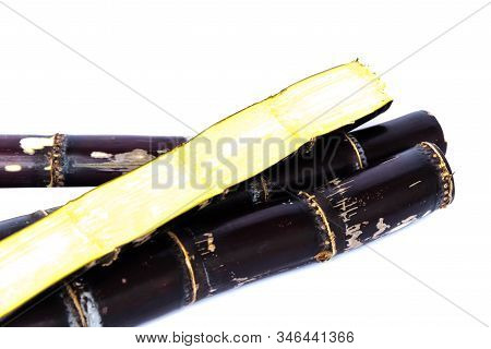 Studio Shot Heap Of Organic Sugarcane Stalks With Half Cuts Isolated On White