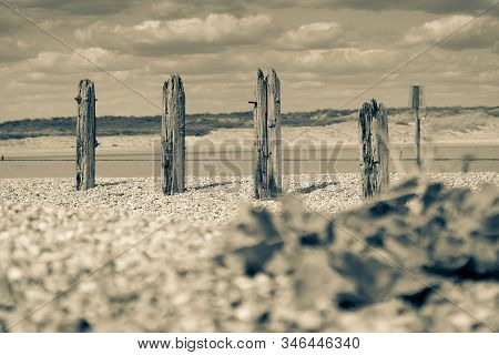 Remains Old Destroyed Pier On Stony Beach Along Rother River And Rye Nature Reserve Split Toned For 