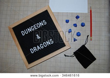 Dungeons And Dragons With Blue Dice And Sign