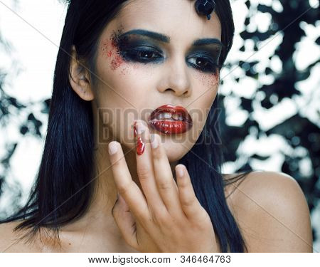 Pretty Brunette Woman With Rose Jewelry, Black And Red, Bright Make Up Kike A Vampire Closeup Red Li