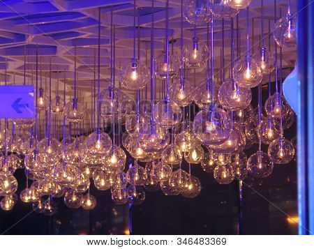 Beautiful Glass Ceiling Lights Hanging From Blue Ciling In Hong Kong Hotel