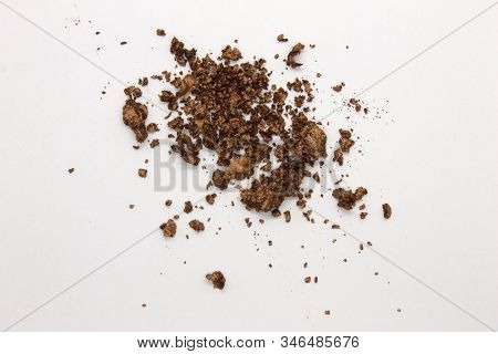 This Is A Photograph Of A Metallic Bronze Powder Eyeshadow Isolated On A White Background