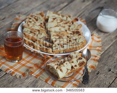 Traditional Apple Pie, Cupcake With Dried Apples, Closeup Presented On A Wooden Table. Home Cooking.