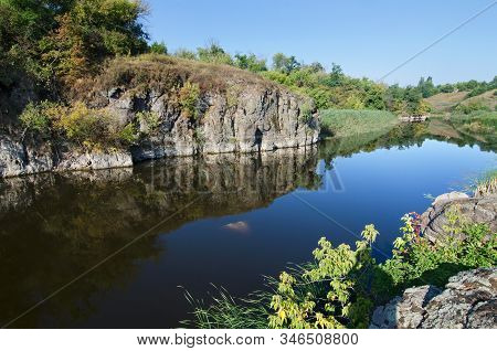 Stone Cliff On The River Bank On Sunny Day. Tyasminsky Canyon  In Kamianka Cherkasy Region. Ukraine