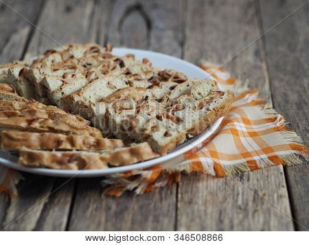 Traditional Apple Pie, Cupcake With Dried Apples, Closeup Presented On A Wooden Table. Home Cooking.